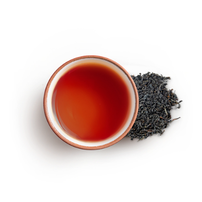 Cup of English breakfast tea with black tea leaves